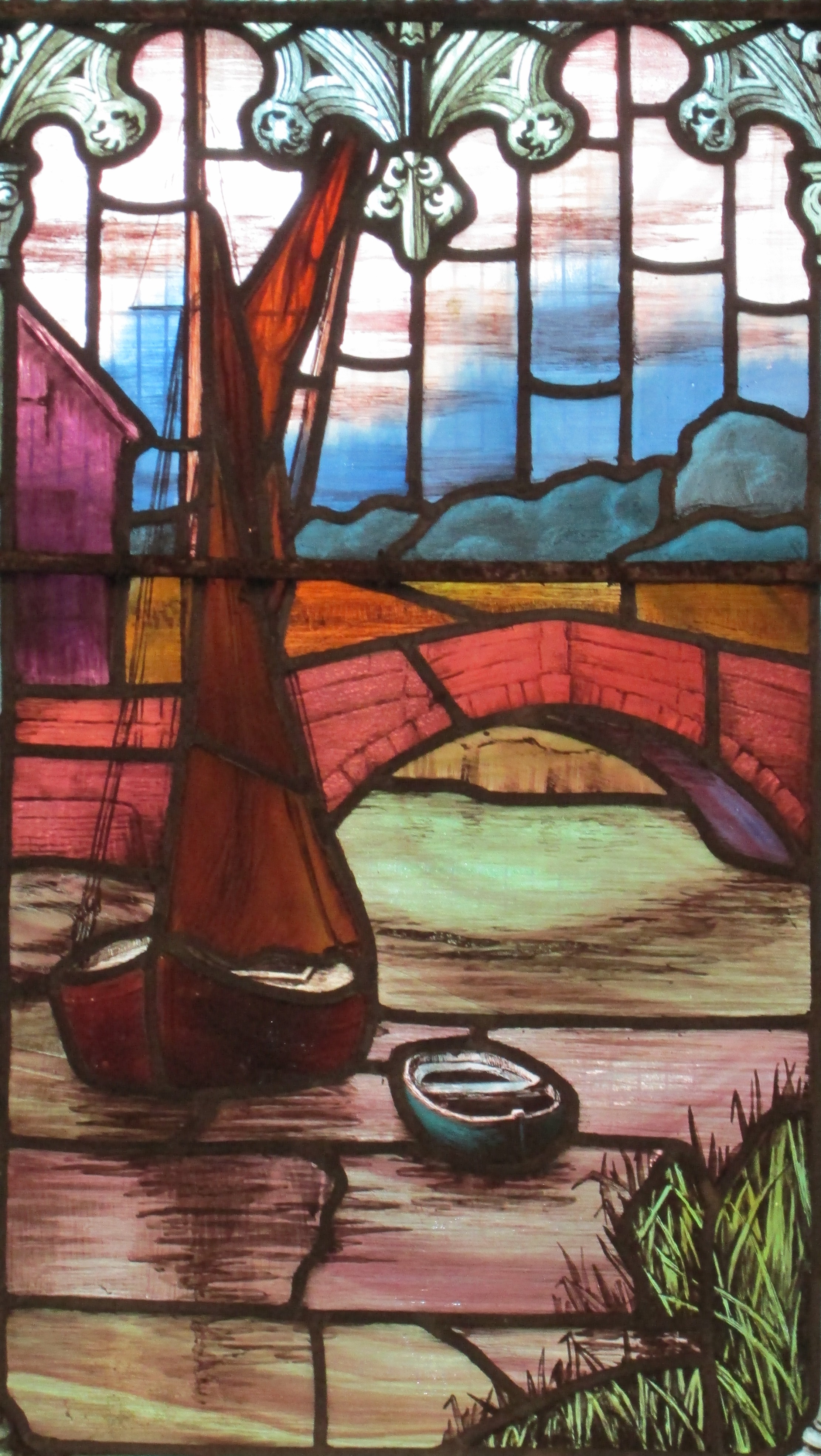 stained-glass window by Mary Lowndes featuring old Snape Bridge